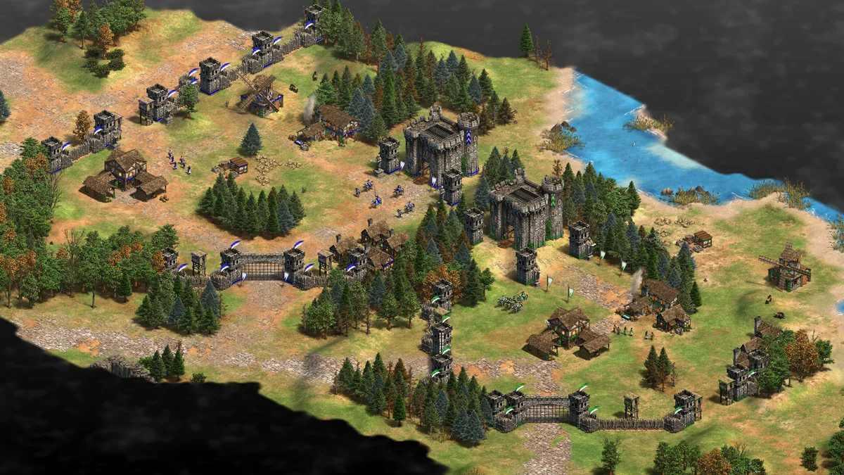 Two neighboring allied bases in an Age of Empires II Definitive Edition co-op mission