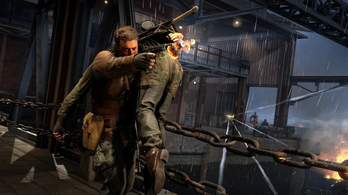 Harry Hawker carrying a man while taking fire in Sniper Elite: Resistance